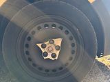 a close up of a car tire with a star on it