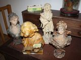 many figurines sitting on a table in a room