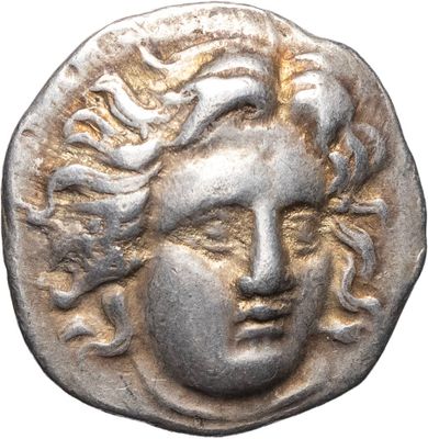 a silver coin with a woman ' s face on it