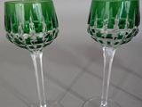 two wine glasses that are sitting on a table