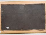 a picture of a blackboard hanging on a wall