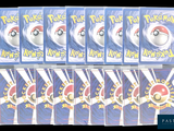 six packs of pokemon cards are stacked on top of each other