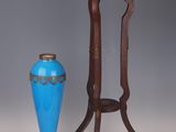 two vases sitting next to each other on a table