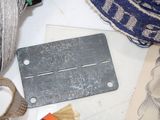 a pair of scissors, a pair of scissors, and a piece of paper on a table