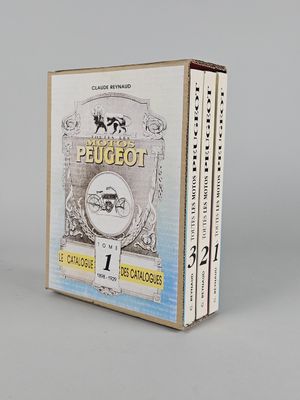 two books in a box on a white surface with a gray background