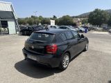 a black car that is parked in a parking lot