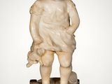 an image of a statue of a child on a stool