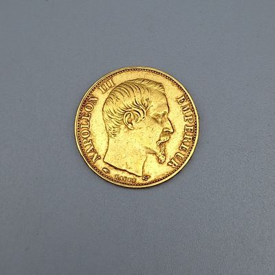 l'image d'une pièce d'or sur laquelle figure le visage d'un homme