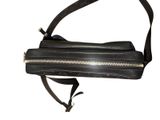 black leather cross body bag with gold zippers and a strap