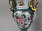 two vases that are sitting on a table