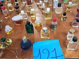 a table with a lot of bottles of perfume on it