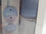 a box with a bottle and a baby bottle inside of it