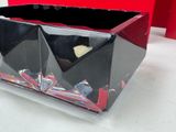 a black and red box with a heart inside of it