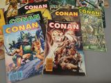 a lot of comic books that are on the table