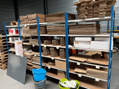 many shelves with boxes and boxes on them in a warehouse