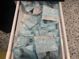 a drawer full of medical supplies that is sitting on the floor