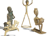 three bronze figurines of a man and a woman with a baby