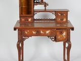 an old wooden desk with a mirror on top of it