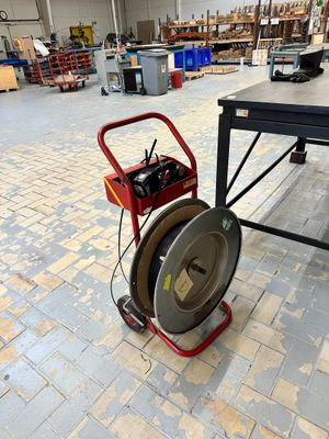 a machine that is sitting on a table in a warehouse