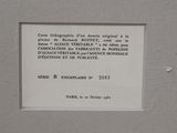 a plaque on the wall of a building with a picture on it