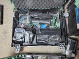 many tools in a case that are sitting on the floor