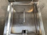 a stainless steel oven with a door open on the floor
