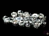 some very pretty white diamonds on a black surface