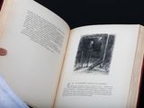 a person holding an open book with a picture on it