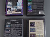 three video game cases sitting on top of a table next to each other