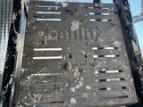 a close up of a metal grate with holes in it