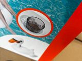 a cardboard box with a picture of a man in a swimming pool