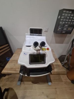 a machine that is sitting on top of a wooden table