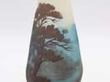 a vase that has a picture of a tree on it