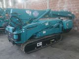 a blue machine that is parked in a building