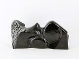 a black sculpture of a man and a woman