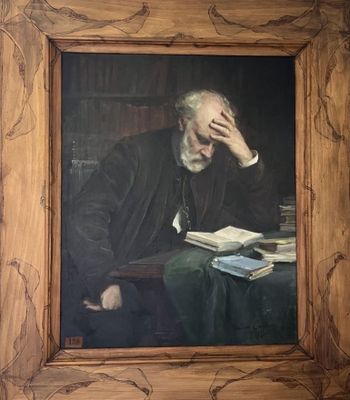 tableau représentant un homme assis à une table, un livre à la main
