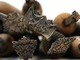 a pile of old metal objects on a white surface