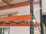 a large rack in the middle of a room with shelves