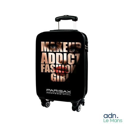 une valise noire sur laquelle est représenté le visage d'une femme