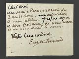 an old piece of paper with writing on it sitting on top of a table