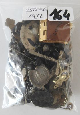 a bag full of assorted buttons and chains
