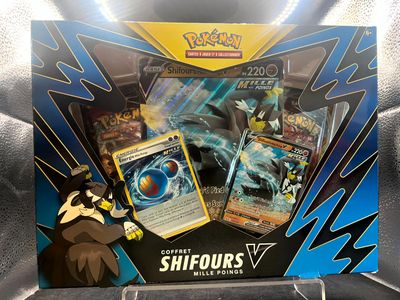 a box of pokemon cards on display in a display case