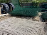 a large pile of metal mesh on the ground