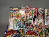 a lot of comic books sitting on a table