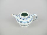 a small blue and white teapot with a handle