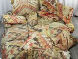 a couch that has a lot of pillows on top of it
