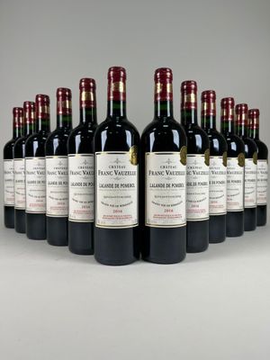 six bottles of red wine are lined up in a row