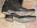 a close up of a pair of shoes on a tiled floor