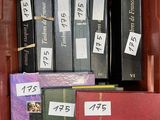 a lot of books that are in a red box