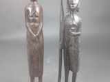 paire de statues en bois représentant une femme et un homme muni d'une épée